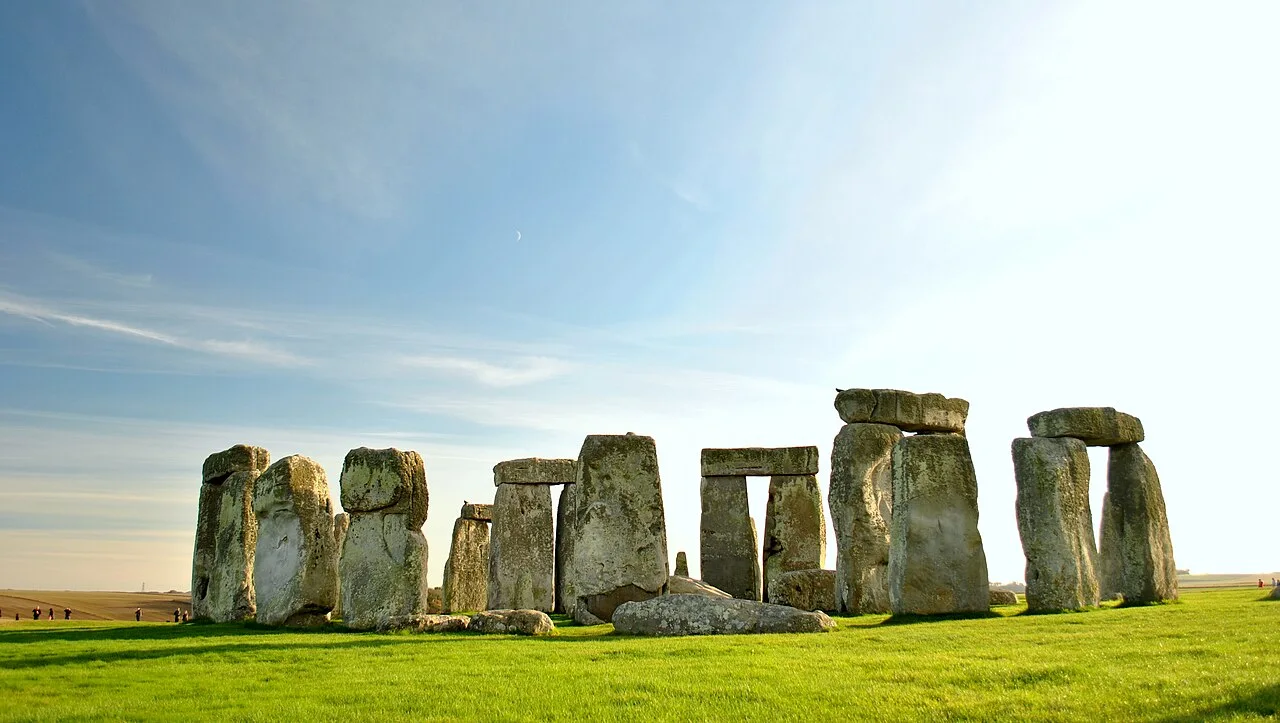The ancient stones of Stonehenge beneath a blue sky